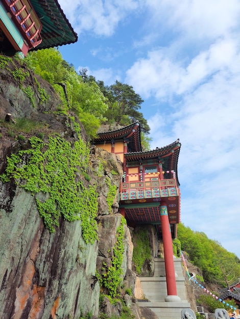 a photo of a temple built on a cliff in gurye south korea