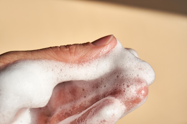 Photo of the texture of cosmetic foam on the hand