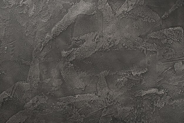 Photo of textured dark grey concrete wall