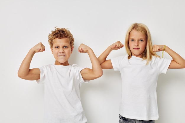 Photo of two children Friendship posing together childhood unaltered