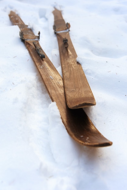 Photo of vintage old wooden skis on the terrace of a country house