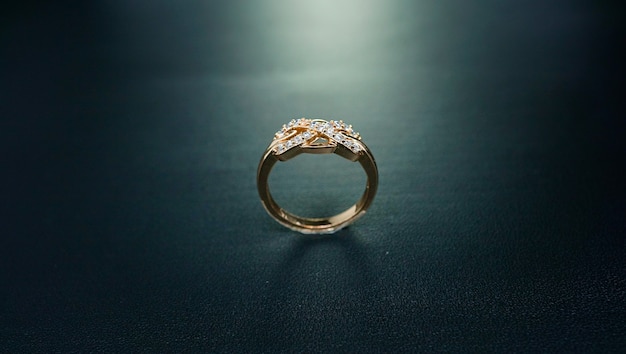 photo of wedding ring with dark background