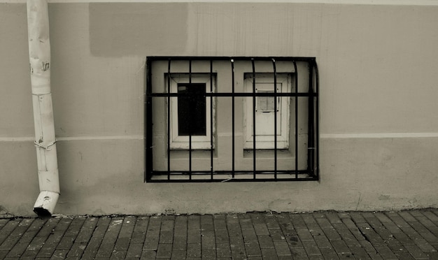 Photo window with bars of an old building