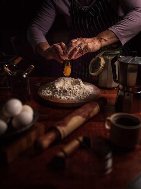 photo of woman cooking dough