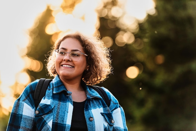 A photo of a woman hiking with a backpack Selective focus