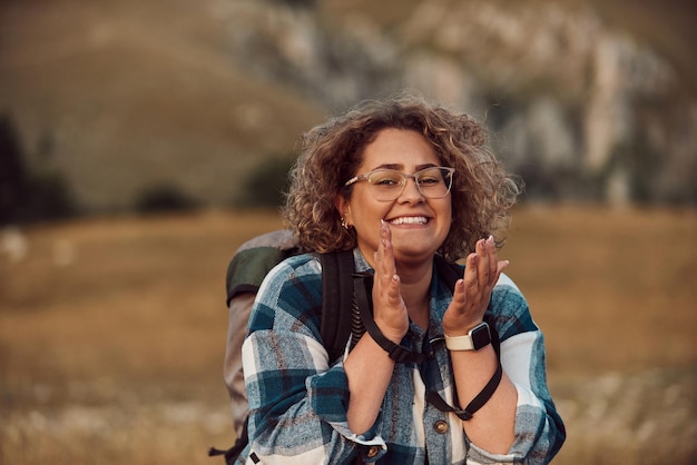 A photo of a woman hiking with a backpack Selective focus