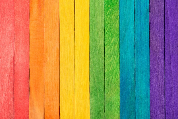 Photo of wooden colorful rainbow background made of wooden planks with copy space for text