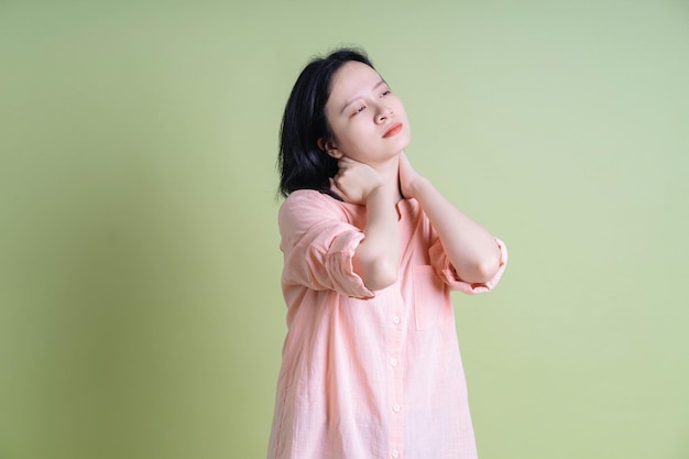 Photo of young Asian woman on background