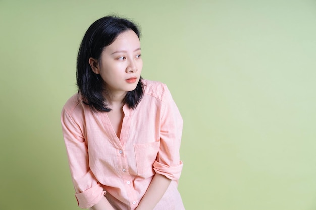 Photo of young Asian woman on background