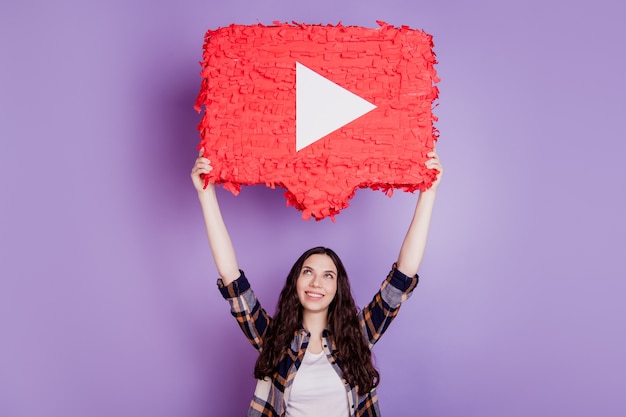 photo of young attractive girl happy positive smile look hold hand icon video play isolated on violet color background