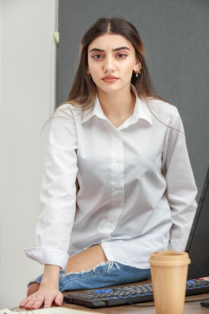 Photo of young businesswoman looking at the camera with confidence