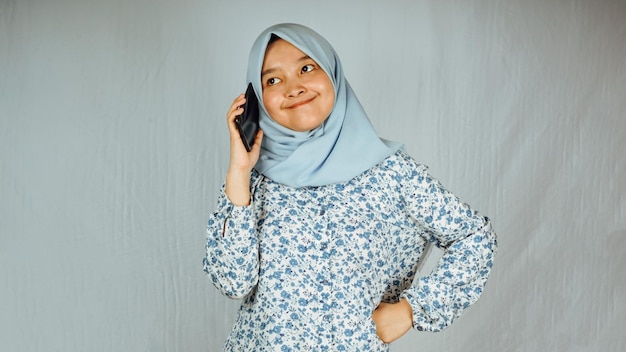 Photo of young happy positive good mood businesswoman holds smartphone