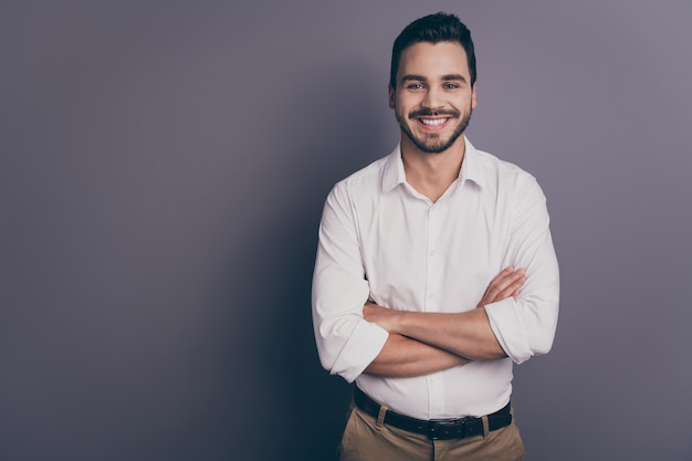 Photo of young macho business man employer arms crossed