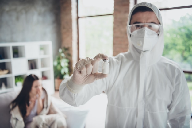 photo of young sick patient lady doc preparing medication bottle