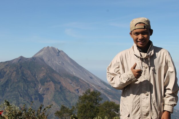 photo of youth joking with friends on the mountain