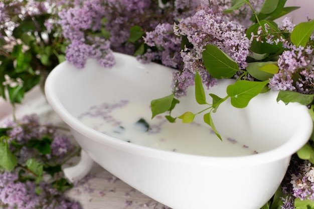 photo zone for a photo shoot with lilac. bath with flowers