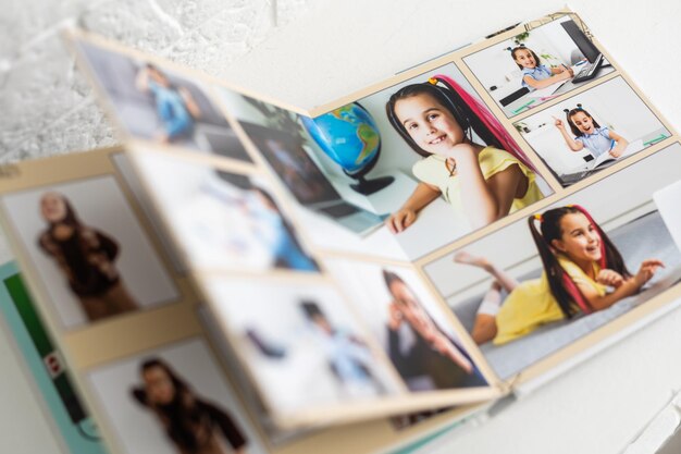 Photo photobook of a little girl. family, childhood and leisure concept.