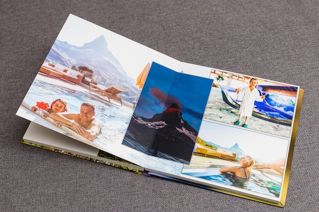 the photobook opened, travel in switzerland, on gray background