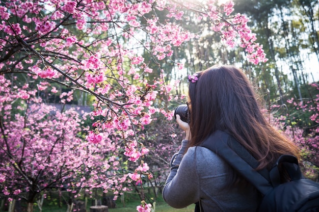 Photograher holding DSLR Camera for shoot photo in Chiangmai ,Thailand