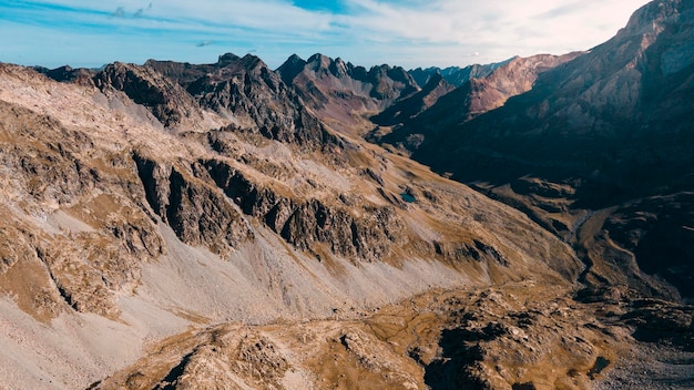 Photograph of a boy admiring the immensity of the mountains in the Panticosa Valley, a trekk day