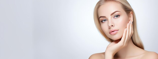 Photo photograph of a female model with clean and healthy skin touching her face taken on a studio background