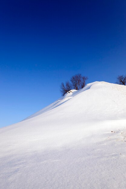 Photographed close-up of a snow-covered hill.