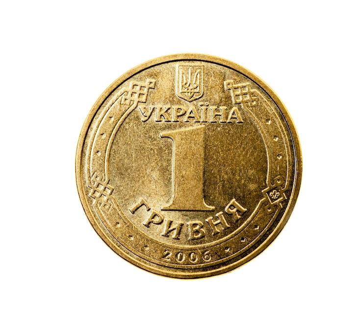 Фотография сфотографирован крупным планом на белой монете, одна украинская гривна