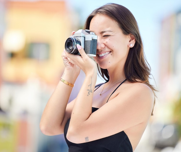 Photographer city photography and digital camera woman take urban photoshoot for memory on world global or international travel Vacation tour smile and happy asian girl shooting outdoor Singapore