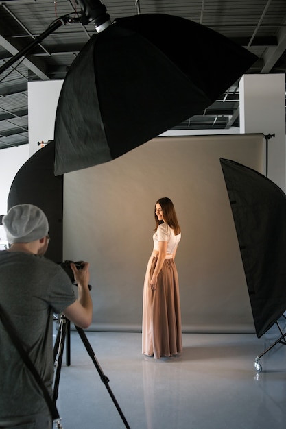 Photographer and happy model at studio session