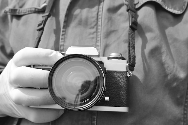 Photographer holding a film camera