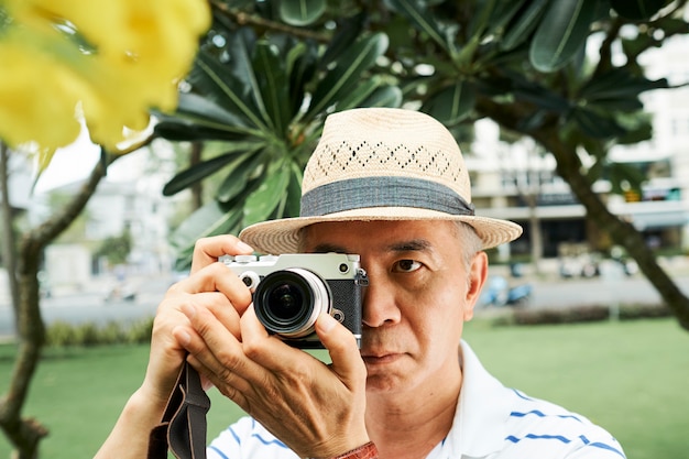 Photographer making photo of plants