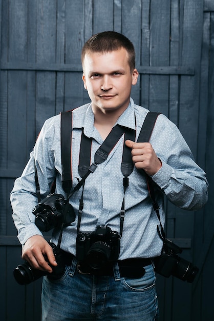 Photographer man with journalist cameras