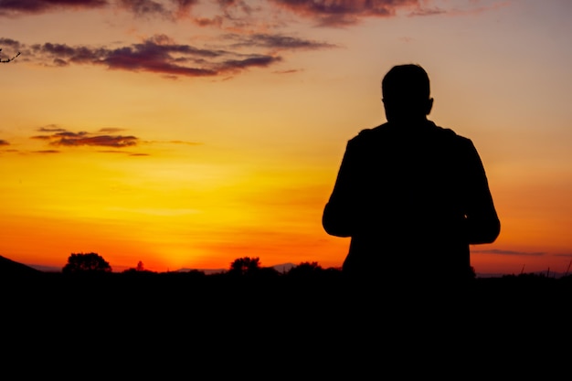 Photographer photographs the sunset on the mountains