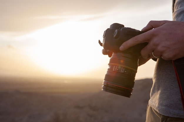 Photographer photographs the sunset on the mountains