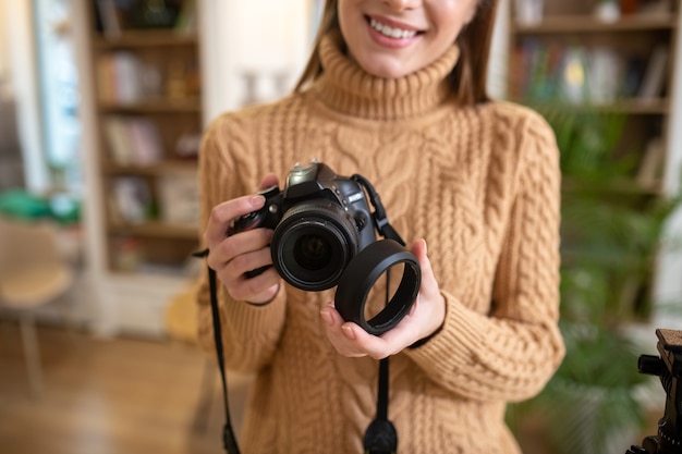 A photographer putting the blend off her camera