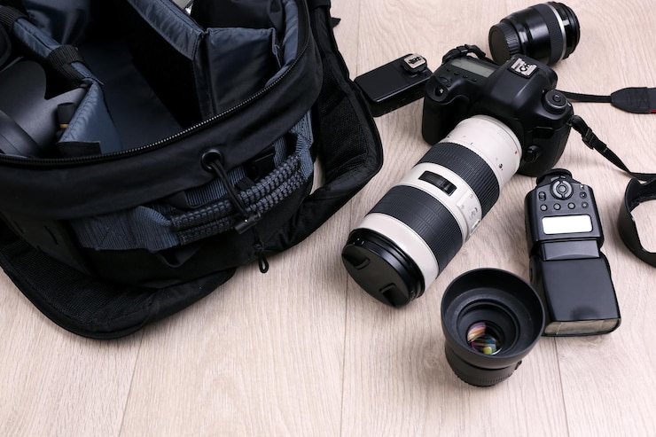 फोटो photographer's equipment on the floor in a room
