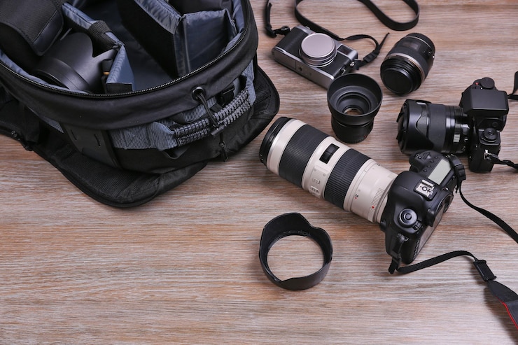 फोटो photographer's equipment on the floor in a room