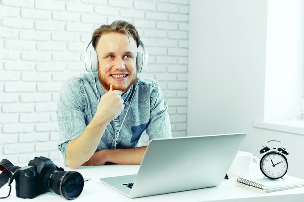 Photographer selecting photos on his computer