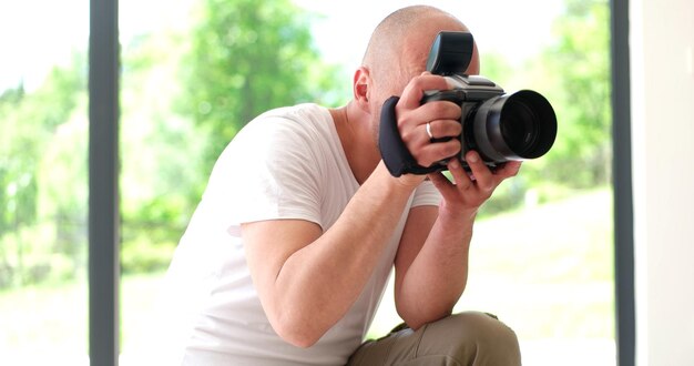 Photographer takes pictures with DSLR camera