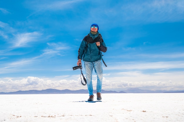 Photographer walking in Salar de Uyuni