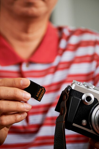 Photographer with camera and memory card