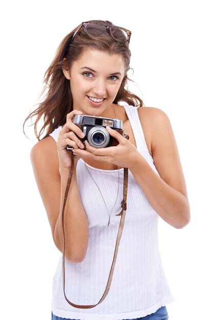 Photographer woman and portrait with retro camera in studio for photoshoot content creation and paparazzi magazine on white background Happy journalist photography or lens for creative production