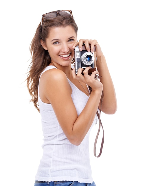 Photographer woman or portrait with retro camera in studio for photoshoot content creation and production on white background Happy journalist photography or creative media for paparazzi magazine