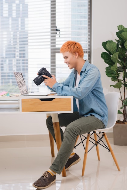 Photographer working at desk in modern office