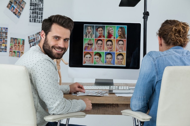 Photographers working at desk