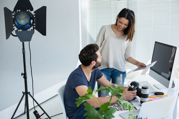 Photographers working together at desk