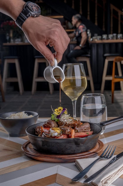 photography of a gourmet food plate on a restaurant table By Yuri Ugarte Cespedes