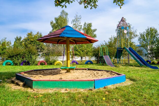 Photography on theme empty wooden sandbox with sand for kids