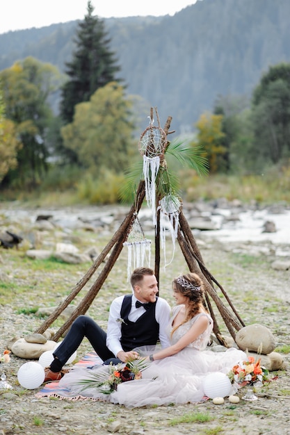 Photosession of a couple in love. Wedding ceremony in the style of boho