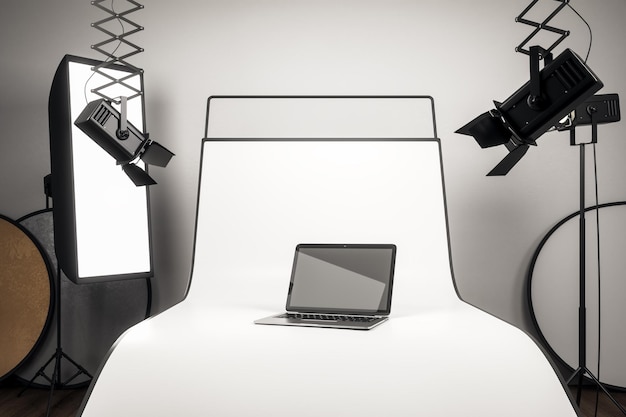 Photostudio with blank laptop